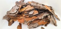 a pile of wood chips sitting on top of a white table