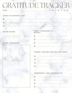 a white marble background with the words gratitude tracker on it