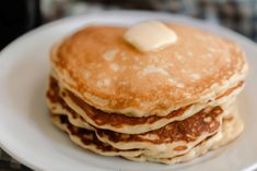 a stack of pancakes with butter on top