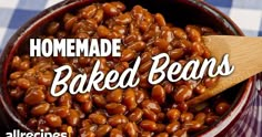 homemade baked beans in a bowl with a wooden spoon on the side and text overlay reading homemade baked beans