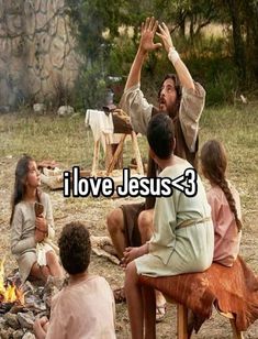 a group of people sitting around a campfire with the caption i love jesus 3