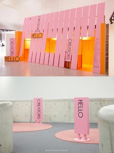 there are pink and orange signs on the floor next to each other in this room