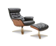 the reclining chair and ottoman is shown in black leather with wooden legs, which are also