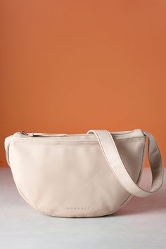 Introducing our brand new half-moon vegan leather handbag. This modern and stylish bag is the perfect accessory to any fall look. Our team loves it and we're sure you will too!
Made from vegan leatherCruelty free and easy to care forTop zipper to keep your belongings safeWomance logo embossed on the frontStrap adjustable up to 39"Can be worn as a shoulder or cross-body bagTwo inside pockets (one with zipper)Dimensions: 12.5" (width) x 7.25" (height) x 3" (depth)Exterior: vegan leather, 100% Poly Trendy Faux Leather Bag For On-the-go, Modern Faux Leather Baguette Bag With Zipper, Trendy Soft Leather Hobo Bag, Trendy Faux Leather Crossbody Baguette Bag, Trendy Large Capacity Belt Bag For Everyday, Trendy Faux Leather Hobo Bag, Trendy Faux Leather Bag For Everyday, Modern Large Capacity Belt Bag For Everyday, Trendy Baguette Bag With Zipper Pocket For On-the-go