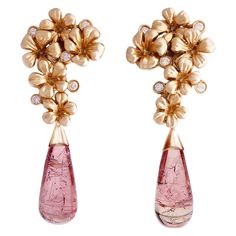 These contemporary Plum Blossom cocktail earrings are made in 18 karat rose gold and encrusted with 10 round diamonds and removable drops of natural rose tourmalines (about 16.4 carats in total), which can be taken off. This jewelry collection was featured in Vogue UA and designed by oil painter from Berlin, Polya Medvedeva. We use top natural diamonds, VS, F-G and work with a German gem company that has been in the market since the 19th century. The sculptural design adds extra highlights to th Designer Earrings Studs, Sparkling Jewelry, White Diamond Earrings, Earrings With Diamonds, Cocktail Earrings, Contemporary Earrings, Natural Jewelry, Gold Cocktail, Sparkle Jewelry