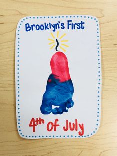 a wooden table topped with a sign that says brooklyn's first 4th of july