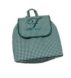 a green and white checkered bag on a white background