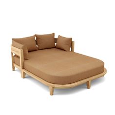 a wooden bed with pillows on top of it and an arm rest in the shape of a reclining couch