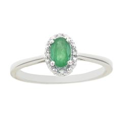 You'll love the impressive design of this sterling silver ring. You'll love the impressive design of this sterling silver ring. Width: 0.32 in. Base material: sterling silver Plating: rhodium Finish: polished Packaging: boxed Additional details: nickel free STONE DETAILS Type: emerald Total weight: 3/8 ct. Center stone size: 6 x 4 mm Color: green Shape: oval Setting: prong DIAMOND DETAILS Total weight: less than 1/10 ct. Clarity: I2, I3 Color grade: H, I Diamond weights are approximate. Diamond Classic White Gold Diamond Ring With Oval Cabochon, White Gold Oval Cabochon Ring With Polished Finish, Classic White Gold Emerald Ring With Halo Design, Silver Oval Birthstone Ring With Halo Design, Silver Oval Halo Birthstone Ring, Silver Oval Halo Design Birthstone Ring, Classic 14k White Gold Emerald Ring In Silver, Classic White Gold Oval Cabochon Ring, Fine Jewelry Silver Ring With Oval Cabochon