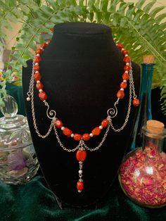 "\"Tea Party in the Attic\" This is a handmade one-of-a-kind necklace  Made with red agate, glass beads and silver plated components" Unique Red Agate Beaded Necklaces, Red Agate Beaded Bohemian Necklace, Red Agate Bohemian Beaded Necklace, Red Necklaces With Silver Beads For Festival, Red Necklace With Silver Beads For Festival, Unique Red Carnelian Necklaces, Handmade Red Carnelian Beaded Necklaces, Artisan Red Carnelian Beaded Necklaces, Silver Beaded Carnelian Necklace