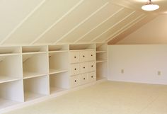 an attic remodel with white shelving and pink background text overlaying the image