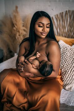 a woman holding a baby in her arms