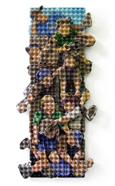 a group of people made out of legos sitting on top of a white wall