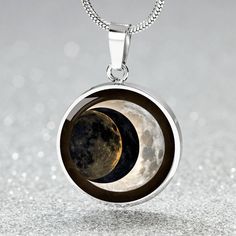 Experience the celestial magic with our Personalized Total Solar Eclipse 2024 Pendant Necklace. Adorn yourself with the allure of the night sky through our Custom Lunar Eclipse Jewelry. Celebrate cosmic wonders with our Astronomy Skies Charm, capturing the essence of celestial beauty. Gift a cherished memory with our Engraved Jewelry, symbolizing the timeless allure of lunar eclipses. Personalize it with engraving to commemorate the special moment, as custom touches never fail to bring joy to th Silver Celestial Metal Necklace, Symbolic Metal Necklace With Moon Phase Detail, Celestial Metal Pendant Necklace, Minimalist Black Moon Necklace, Celestial Moon Shaped Necklace With Moon Print, Eclipse Necklace, Eclipse Jewelry, Mystical Moon-shaped Metal Necklace, Sun And Moon Necklace