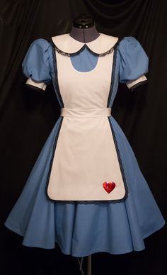 a blue and white dress with a red heart on it