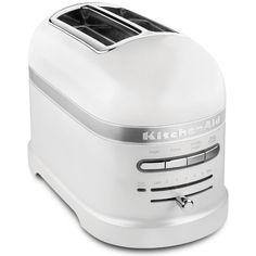 a white toaster sitting on top of a counter