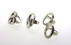 Different oval rings made of pewter by the Danish designer Bent Larsen. There is a choice between a small single oval, a large single oval, a double oval and a triple oval ring. Dimensions and weights are: Small single oval: 26 x 18 mm, 6,7 grams Large single oval: 30 x 21 mm, 8,7 grams, also silver-plated available Double oval: 33 x 22 mm, 13,4 grams, also silver-plated available Triple oval: 35 x 27 mm, 17,8 grams, also silver-plated available All rings are adjustable. The markings on these ri Pewter Ring, Oval Ring, Oval Rings, Solitaire Ring, Netherlands, Silver Plate, Onyx, Silver Plated, Jewelry Design