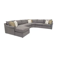 a large sectional couch with pillows on the top and bottom corner, in grey fabric