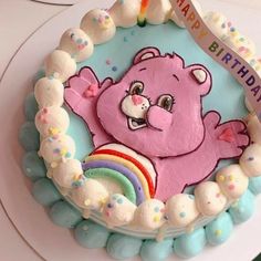 a birthday cake with a pink bear on it