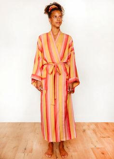 Super soft, richly hued, 100% cotton long robe in Hush, a happy mix of pink, coral and yellow. Bathrobes are handwoven in India by Fair Trade social enterprises. Complete your after-bath look with the matching hair wrap, scrunchie, and make-up bag. Perfect for bridesmaids robes. Cotton Palazzo Pants, Bridesmaid Hair Long, Time Routine, Loose Braids, Coordinating Outfits, Long Wavy Hair, Bridesmaid Robes, Pink Coral, Make Up Bag