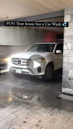 a white car is parked in a garage with the words pov your house has a car wash on it