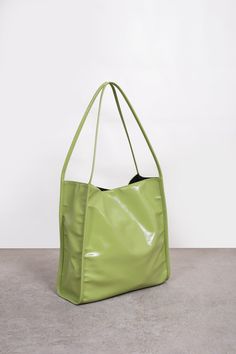 Shop for Lime green high shine PVC tote bag at Glassworks London. Free UK shipping for orders over £75. Buy Now Pay Later with Klarna. Chic Glossy Finish Tote Shoulder Bag, Chic Glossy Tote Shoulder Bag, Glossy Finish Tote Shoulder Bag For Shopping, Glossy Finish Shoulder Tote Bag For Shopping, Modern Green Shoulder Bag For Errands, Glossy Finish Shopping Bags With Double Handle, Modern Green Shopping Bag, Modern Green Shoulder Bag With Large Capacity, Green Double Handle Bags For Weekend