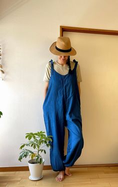 "* * * Ethical clothing* * * This is a very comfortable 100% cotton summer jumpsuits. 100% natual indigo dyed. Using exactly the same cotton for lining. It is very soft and gentle touch to your skin. There are side pockets. This time came out very beautiful color Hope you will enjoy the natural color of indigo! Only 2 pcs in stock! - Material: 100% cotton - Double Cotton ( 2 layers ) - Color: Indigo ( Natural dye) - Side Pockets - Size - Bust : Approx 100cm/ 39\" - Hip : Approx. 112cm/45\" - 2 l Cotton Jumpsuit For Loungewear, Cotton Loungewear Jumpsuit Overall, Cotton Loungewear Overalls, Cotton Overall Jumpsuits For Loungewear, Cotton Overalls For Loungewear, Solid Cotton Overalls For Loungewear, Summer Cotton Jumpsuit With Relaxed Fit, Casual Cotton Overalls For Beach, Cotton Summer Overalls For Beach