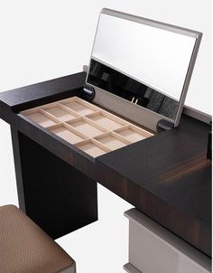 a desk with a mirror and drawers on it