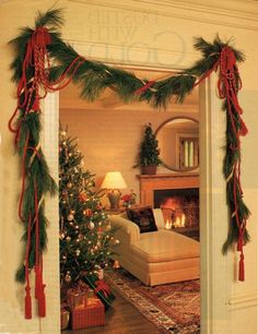 a living room decorated for christmas with decorations on the fireplace mantel and garland around the tree