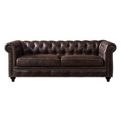 a brown leather couch sitting on top of a white floor