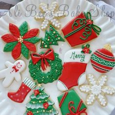 decorated christmas cookies on a white plate