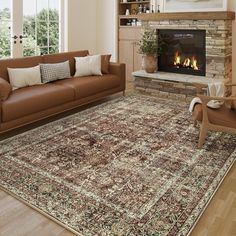 a living room filled with furniture and a fire place