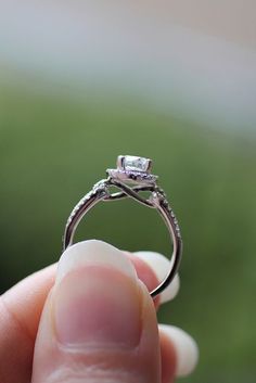 a person holding a ring in their hand