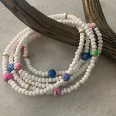 White Seed Beads With Painted Polymer Beads And Gold Tone Accents. Length Is 19 Inches. Can Also Be Worn As Necklace. Wraps Up To Five Times, Has 7.5” Circumference. Polymer Beads, Beading Jewelry, Diy Bracelet Designs, A Necklace, Diy Bracelet, Hello Summer, Bracelet Designs, Diy Bracelets, Jewelry Ideas