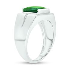 He'll love the eye-catching color of this modern ring. Crafted in cool 10K white gold, this design features a 9.0mm channel-set square-cut verdant-green lab-created emerald. Inlaid rows of diamond accents flank the center and continue along the grooved shank. Buffed to a brilliant luster, this ring makes a bold statement of style. Modern Emerald Ring Vvs Clarity For Promise, Modern Green Rings With Prong Setting, Modern Green Diamond Anniversary Ring, Modern Emerald Promise Ring With Vvs Clarity, Modern Emerald Rings With Center Stone, Modern Emerald Ring With Center Stone, Modern Green Diamond Rings, Modern Green Signet Ring For Anniversary, Modern Emerald Ring With Prong Setting