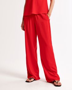 Elevate your wardrobe with the Abercrombie & Fitch Women's Drapey Pull-On Pant, a perfect blend of comfort and chic style. These pants feature:

- Size: XS
- Color: Vibrant Red
- Material: Body lined with a soft blend of Polyester and Elastane
- Gender: Female
- Style: Mid-rise, wide-leg silhouette

Crafted in a luxuriously soft drapey fabric, these pants offer a relaxed fit with an elasticated waistband for ultimate comfort. Functional pockets add practicality, making them ideal for both casual Red Stretch Wide-leg Bottoms, Drapey Pants, Red Wide-leg Pants With Elastic Waistband, Red Stretch Full-length Pants, Red Non-stretch Wide Leg Pants With Pockets, Red Pants Outfit, Red Full-length Elastane Pants, Female Style, Runway Outfits