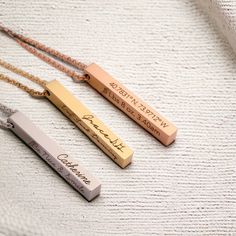 Add a touch of timeless elegance to your style with our Gold Bar Necklace. This delicate piece features a gleaming gold bar pendant suspended from a dainty chain, creating a chic and versatile accessory. Perfect for both casual and formal occasions, this necklace effortlessly elevates any outfit. Treat yourself or surprise a loved one with this classic and sophisticated piece that exudes grace and refinement. What to expect? A beautifully engraved necklace, which you helped create! The necklace will be packed in a gift box. Specifications - Necklace size: 56 cm  - Pendant size: 5x40mm  - Material: stainless steel Lingot D'or, Gold Bar Pendant, Gold Earrings Models, Vertical Bar Necklace, Vertical Bar, Gold Bar Necklace, Dainty Chain, Bar Pendant