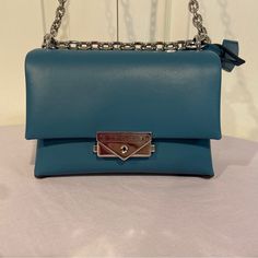 Michael Kors Cece Small Teal Faux Vegan Leather Crossbody Bag Career Party Gift Upgrade Your Fashion Game With This Small Teal Vegan Leather Crossbody Bag From Michael Kors. The Michael Kors Cece Is Perfect For All Occasions Including Travel, Weddings, Parties, Casual, Formal, Workwear, And Business. It Has A Unique Rectangular Shape And Dimensions Of 7 In Width, 5 In Height, And 3.5 In Depth. The Bag Features A Silver Chain Strap With A Handle Drop Of 10-18 In, Making It Comfortable To Wear. Th Formal Blue Flap Bag With Detachable Strap, Blue Rectangular Flap Bag For Formal Occasions, Formal Blue Rectangular Flap Bag, Blue Leather Flap Bag With Magnetic Closure, Blue Flap Bag With Removable Pouch For Formal Occasions, Blue Formal Flap Bag With Removable Pouch, Formal Blue Flap Bag With Removable Pouch, Evening Blue Flap Bag With Detachable Strap, Blue Leather Shoulder Evening Bag