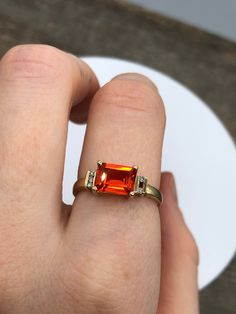 Vintage 10k yellow god ring with a large orange citrine centre and little diamonds on the side. One of the diamonds is missing and there is some wear on the band. Offered at a better price because of these flaws. Very vibrant and in a clean modern style. By Michael Hill Jewellers. Fits size 7 2.81 grams in weight Orange Stone Ring, Vintage Gold Ring, Michael Hill, Orange Citrine, Vintage Gold Rings, Orange Stone, Ring Sale, Citrine Ring, November Birthstone