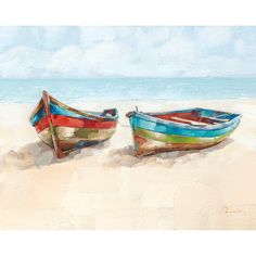 two boats sitting on top of a sandy beach