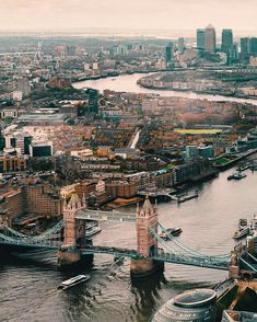 an aerial view of the london skyline and tower bridge