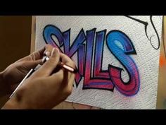 someone is painting the word smile on a piece of paper