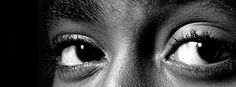 a black and white photo of a woman's eyes