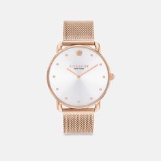 With clean lines and a modern minimalist sensibility the Elliot is a true design classic ready for workdays and weekends. Finished with a sleek mesh bracelet this rose gold tone round watch features a sunray dial detailed with dome markers and our Tea Rose motif at 12 o’clock. | Coach Elliot Watch, 36 Mm - Women's - Rose Gold Coach Luxury Rose Gold Watch, Luxury Rose Gold Coach Watch, Coach Watches Women, Coach Watch, Rose Gold Watches Women, Rose Motif, Round Watch, Mesh Bracelet, Tea Rose