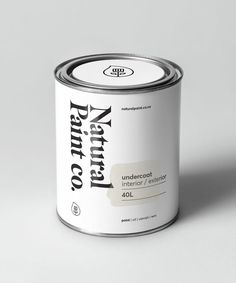 a can of paint sitting on top of a white table