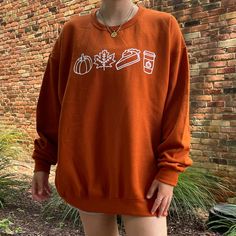 cotton/poly texas orange crewneck. white vinyl design. unisex adult sizing. these are made to order! please allow 2-4 weeks for shipment ᵕ̈ model is 5'5, usually a size small & wearing a size xlarge. Relaxed Fit Orange Sweatshirt With Graphic Print, Casual Crew Neck Sweatshirt With Custom Artwork, Unisex Casual Fall Sweatshirt, Customizable Casual Fall Top, Customizable Casual Tops For Fall, Casual Long Sleeve T-shirt With Custom Artwork, Customizable White Sweatshirt For Fall, Customizable Casual T-shirt For Fall, Fall Doodles