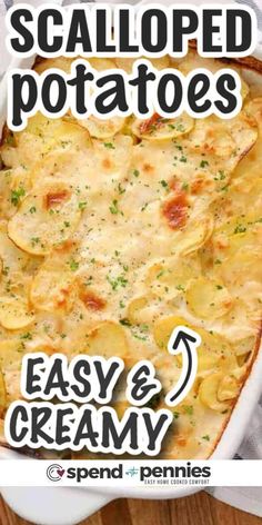 a casserole dish with potatoes and cream in it on a wooden table top