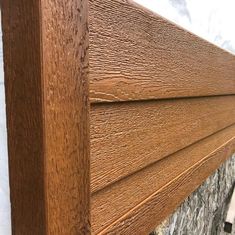 a close up view of the side of a wooden headboard