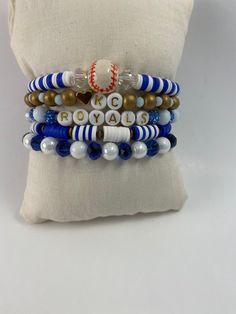 Super cute Kansas City Royals Bracelet features: ⚾️ five separate bracelets  ⚾️ made with stretchy cord ⚾️ approximate size 7.25 ⚾️ one size fits most ⚾️ sold as a set These are the perfect way to cheer on your Royals!❤️⚾️❤️ Blue Adjustable Beaded Bracelets For Team Spirit, Blue Adjustable Bracelets For Team Spirit, Sporty Blue Bracelets For Sports Events, Casual Stacked Adjustable Stretch Bracelet, Casual Adjustable Stacked Stretch Bracelet, Sporty White Stretch Bracelet With Round Beads, White Sporty Stretch Bracelet With Round Beads, Adjustable Multicolor Sporty Bracelets, Sporty Adjustable Stretch Bracelet As Gift