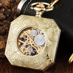 If you're on a budget and need a stylish pocket watch, this is the excellent choice! The creditable skeleton design and astonishing analog display of this watch will polish your look. Notable features are the square case, versatility for both genders, and a gorgeous gold finishing for an elegant classic touch. 

Specifications
Item Type: Pocket & Fob Watches
Case Material: Stainless Steel
Style: Antique
Gender: Unisex
Feature: mechanical pocket watch
Dial Diameter: 0.048m
Bezel Function: Station Collectible Gold Pocket Watch With Skeleton Dial, Antique Gold Pocket Watch With Skeleton Dial, Elegant Gold Hallmarked Pocket Watch, Wedding Ushers, Watch Gift Box, Mechanical Hand, Mechanical Pocket Watch, Collectible Self-winding Yellow Gold Pocket Watch, Antique Yellow Gold Self-winding Pocket Watch